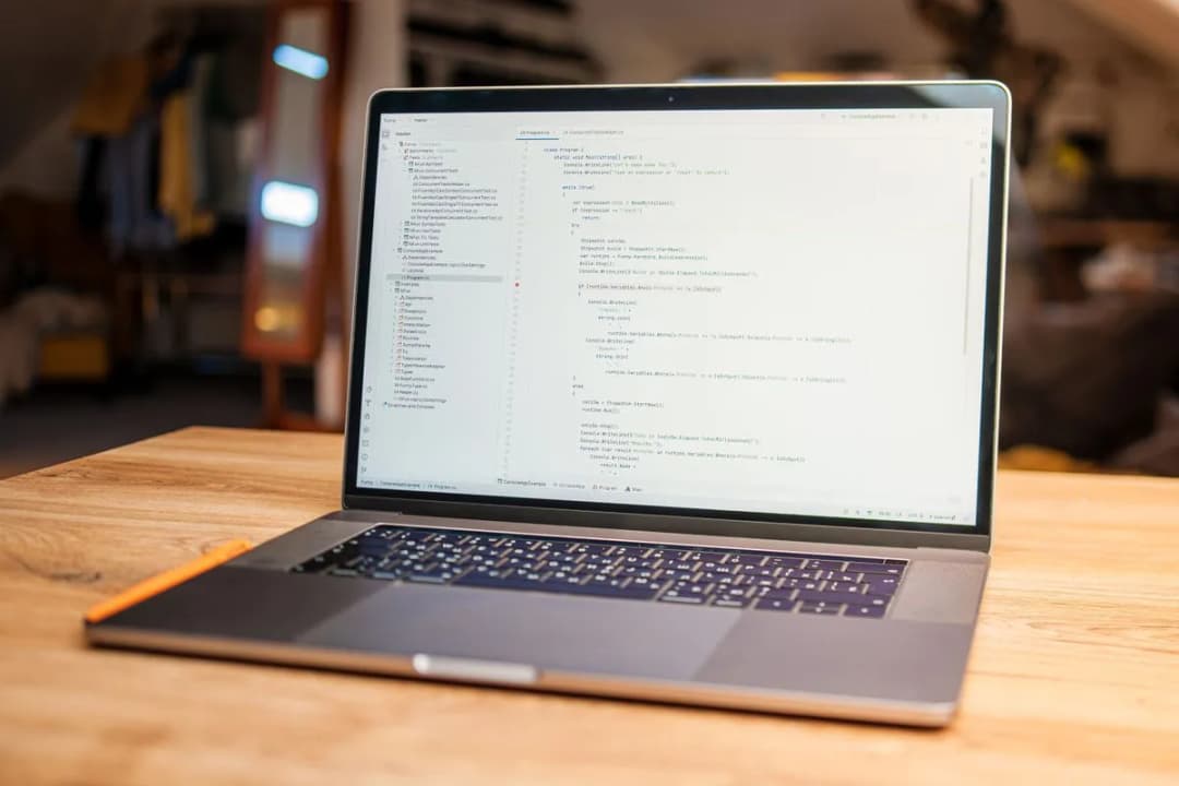 A developer's workspace with a laptop and terminal, representing daily AI-assisted development